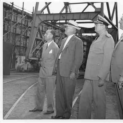 L.D. Smith and C. Ray Christianson with unidentified men