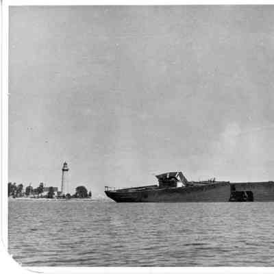 Ore Carrier Bartleme underway with Cana Island Lighthouse on left 1928