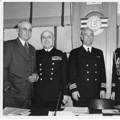 L.D. Smith with three military men in uniforms