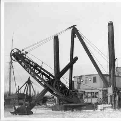 Dredge No.6 with scoop partially in icy water 1933