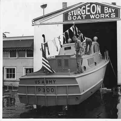 US Army P-300 with Harris Pfeifer standing on dock