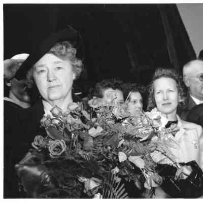 Mrs. William E. Wagener holding roses