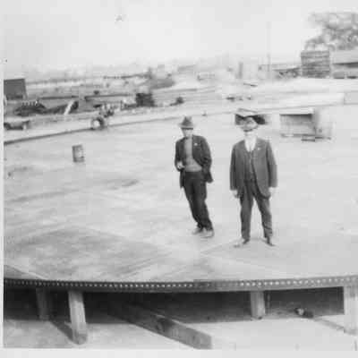 Three men standing on crib foundation