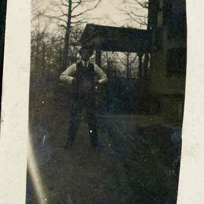 man standing outside a house