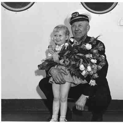 Captain John Roen with daughter Sonia at party