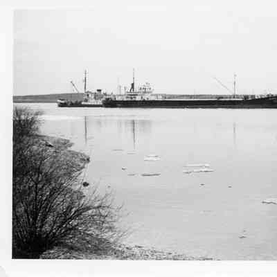 Two Christy Corp vessels on shoreline