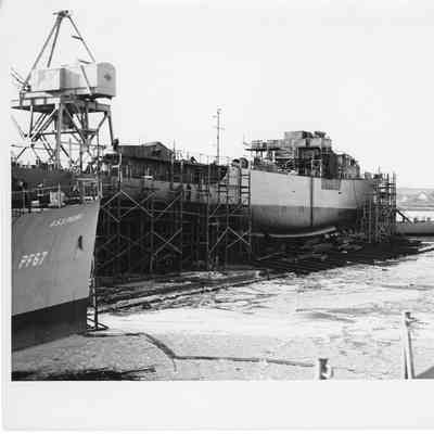 PF-67 USS Peoria and another ship under construction
