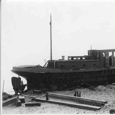 Unidentified tug on shore