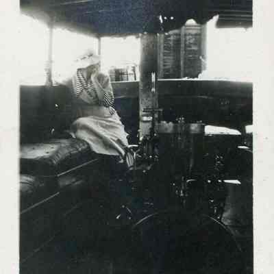 Woman seated in stern of launch Fawn
