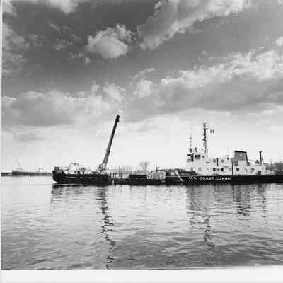 USCGC Mobile Bay attached to barge CGC-12002 underway