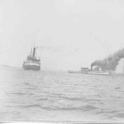Tugboat and steamship near Dunlap Reef