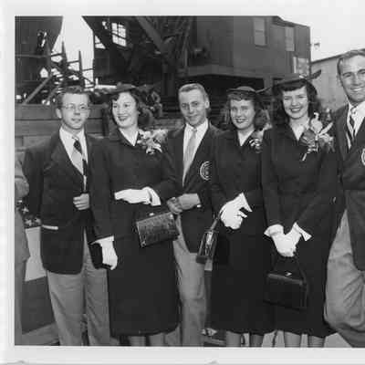 Six people posing at Badger launching September 6, 1952