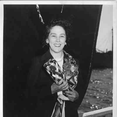 Woman holding christening bottle at christening of FP-371