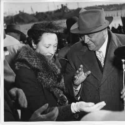 Mrs. W. H. Gallieane at microphone