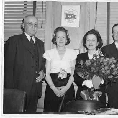 L.D. Smith and Alva Smith with ship sponsor at YW-129 christening