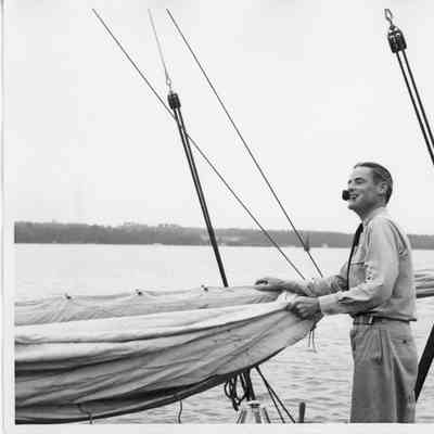Don Fries pipe in mouth standing aboard the Half Moon