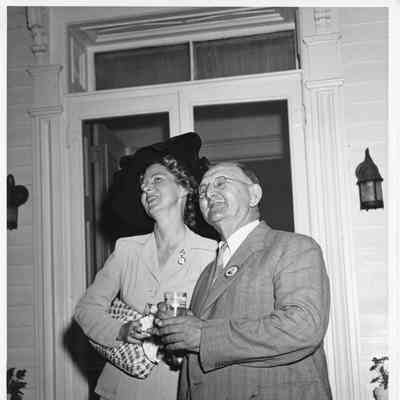 Ed Weber and woman standing in front of door