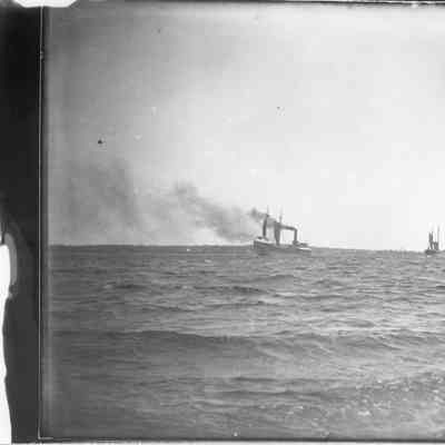 Variety of four vessels underway in open water