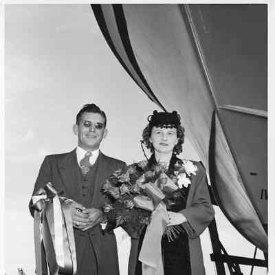 Arhtur and Lucille Gast standing by bow of vessel at Peterson Boat Works 1944