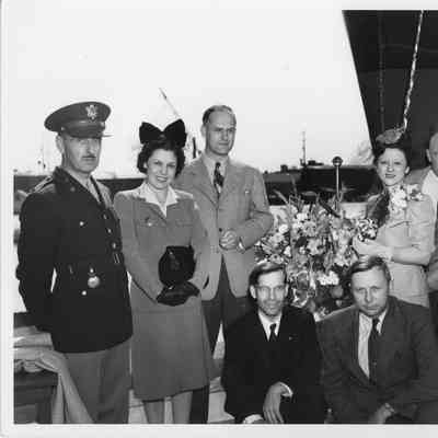 Men and Women at ship christening at SBSB&DD Co.