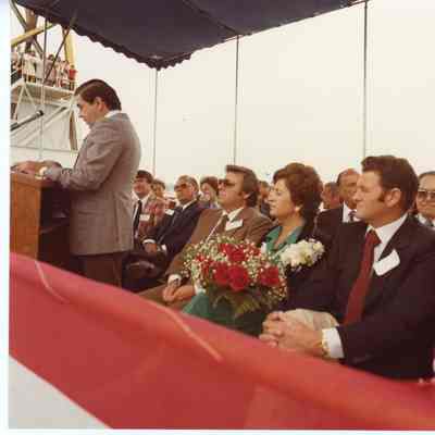 Speaker at podium and crowd at christening of Napolean