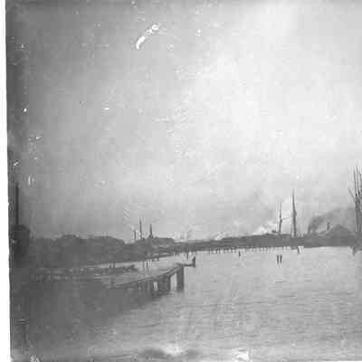 sailing vessels in water near sawmills in Sturgeon Bay