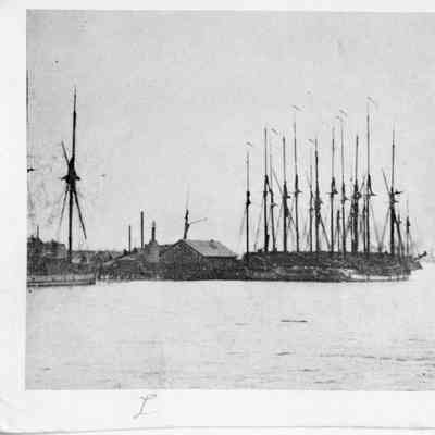 Vessel underway next to dock