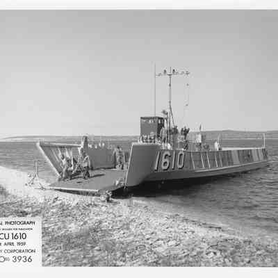LCU-1610 at shore with stern end open April 24, 1959
