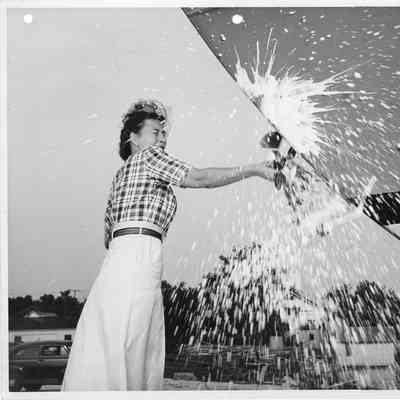 Ship sponsor christening P-573 at Peterson Boat Works September 11, 1944