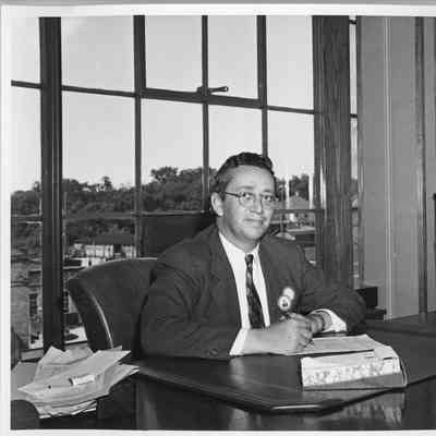 Charles Cowan at desk