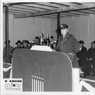 Officer speaking at Army/Navy E award April 20, 1944