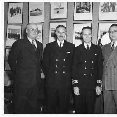 L.D. Smith with three men in office