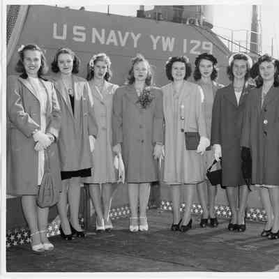 Suzanne and Patsy Smith with seven people in front of YW-129