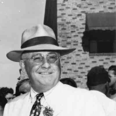 Leathem D. Smith in light colored suit
