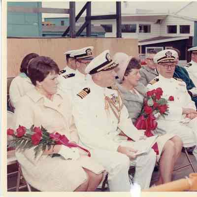 People sitting in sponsor box PG-99 USS Beacon christening