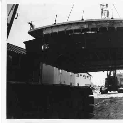 Steel deck/aluminum pilothouse being moved to building berth at PBI Winter 1981