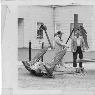 C. Ray Christianson with two men delivering artifact to Florida Street Museum