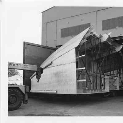 Section of Alcoa Seaprobe being towed out of workshop