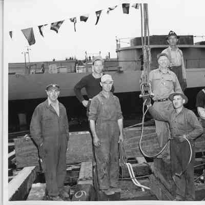 Fred Erdmann, Art Lautenbach, Jake Getzloff, and others in front of PF-66