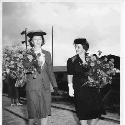 Mrs. Sydney T. Smith and Mrs. John Butterweck walking
