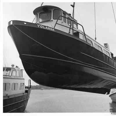 Yolanda suspended in front of fishing tug Eric