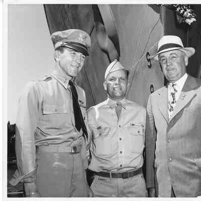 L.D. Smith with two military men in uniforms