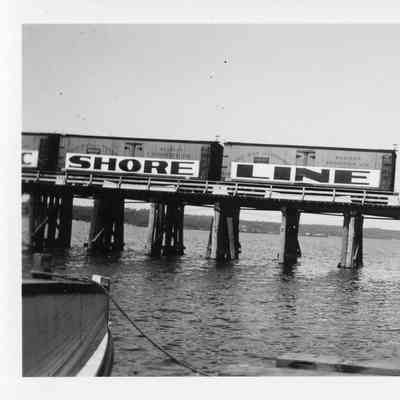 Railroad cars on trestle of Leathem and Smith railroad bridge