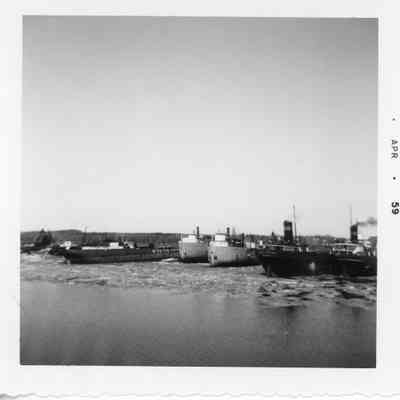 Docked vessels in winter with one belonging to L. Wyandotte Chemicals April 1959
