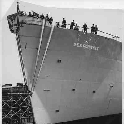 AK-205 USS Poinsett christening with people on board vessel looking down