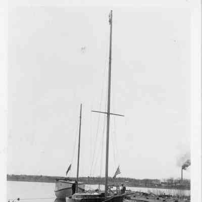 Sailboat Adventure docked at Peterson Boat Works in front of fishing tug 1936
