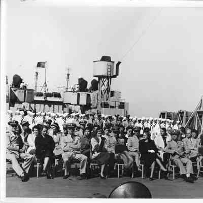 People sitting on deck of LST-1166