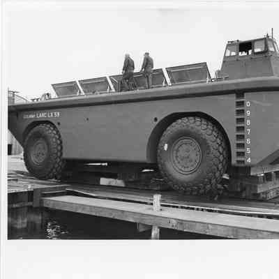 Two men walking on US Army Larc LX 59