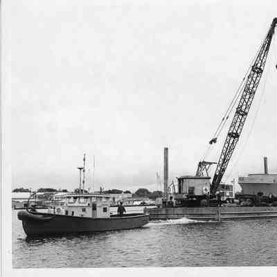 hull on barge no. 1 being towed by tug Escort