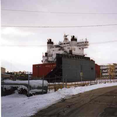 Dredge scow sections alongside Edgar B. Speer at Bay Shipbuilding 2002